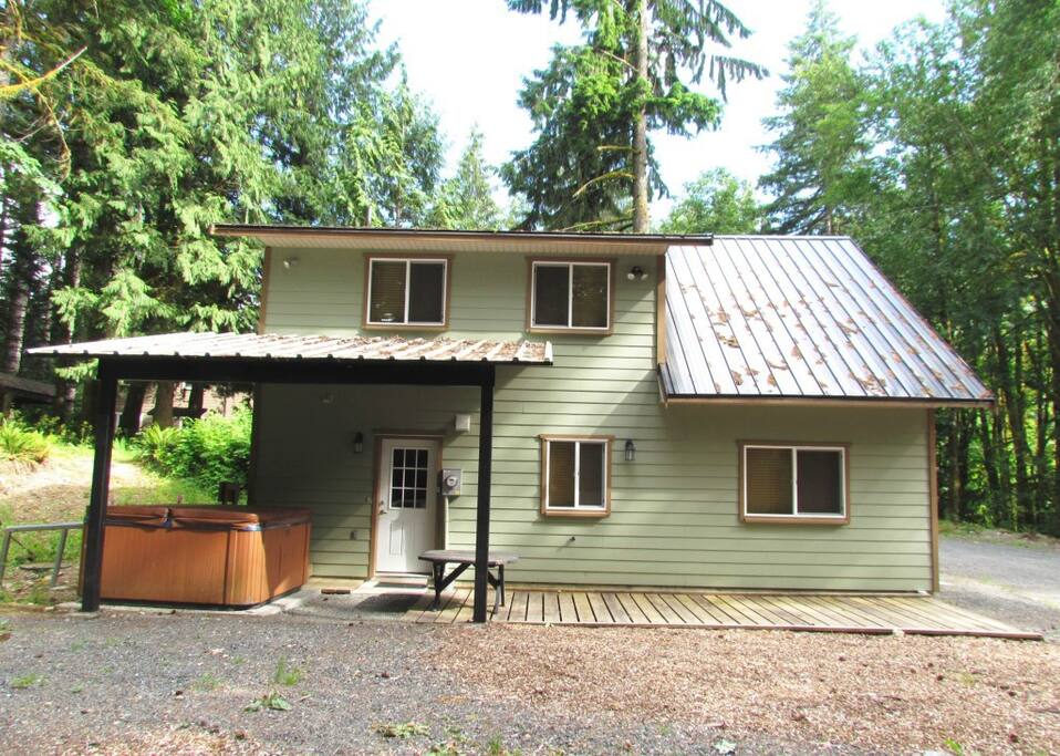 Side of house with hot tub