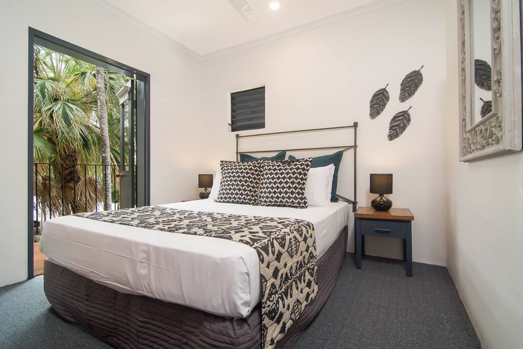 This bedroom has has a small private balcony