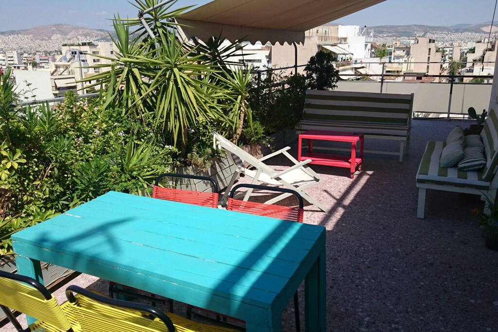 Front terrace with table and view to Acropolis