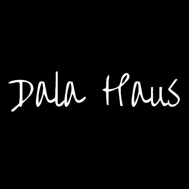 The image displays the name 'Dala Haus' elegantly scripted in white against a black background, conveying a sense of simplicity and modernity.