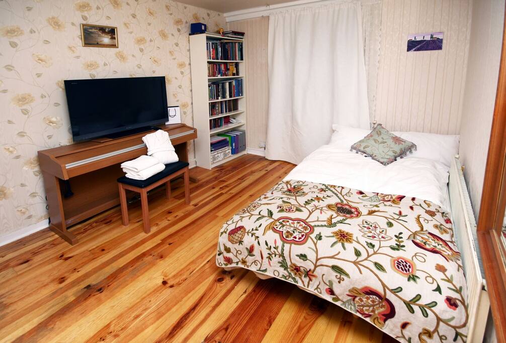Sofabed, unfolded for two guests.