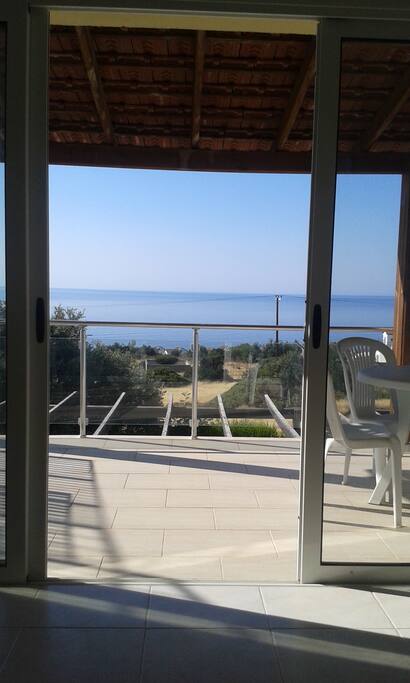 Enjoy the view from the living room looking out onto the large balcony & the sea