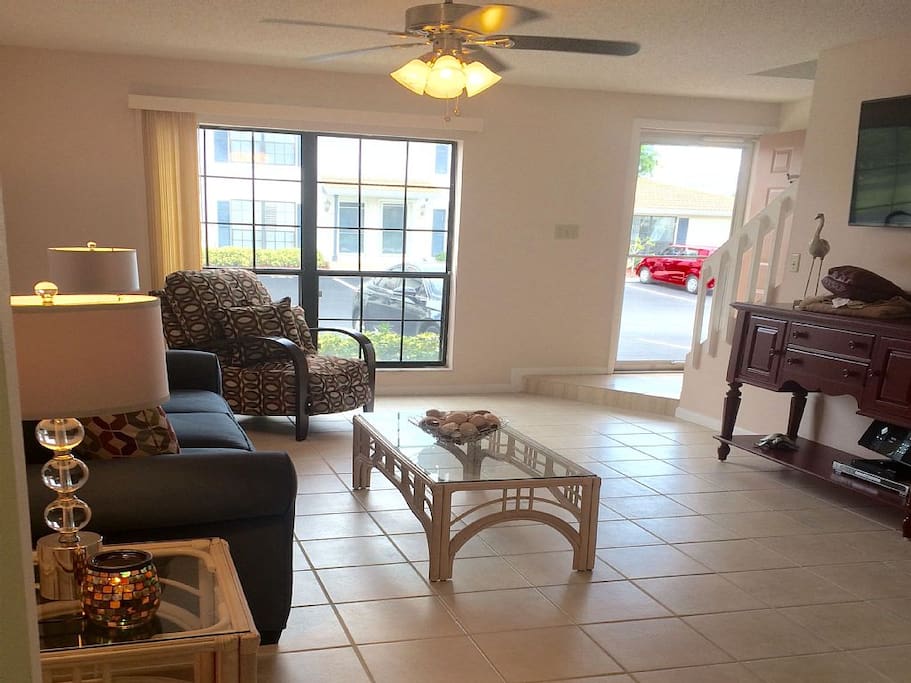 Bright and Spacious Living Room with Sofabed and Comfortable Recliner