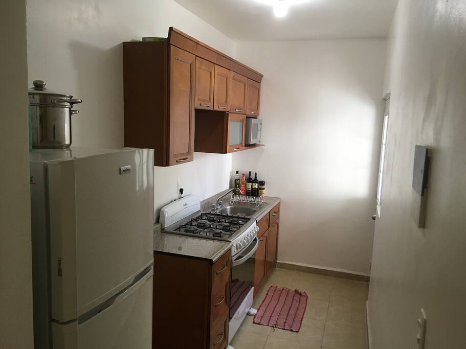 Complete kitchen with gas stove.