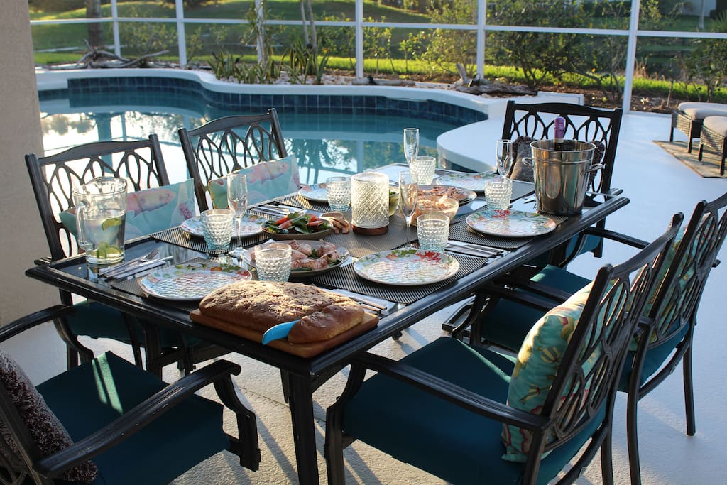 Relaxed dining next to our pool with lake views - grill your meal or bring in from many great local stores
