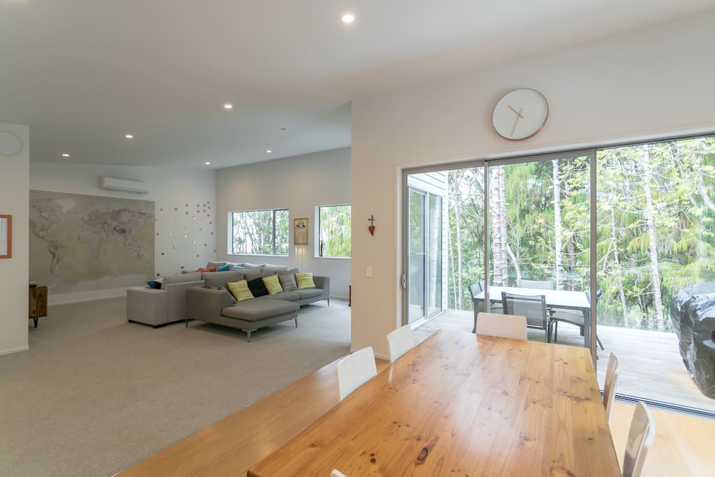A calm space connected with the native bush through huge picture windows.