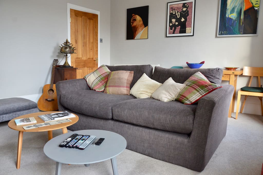 Comfortable sofa and fold out table for 4. Danish Hay coffee tables.