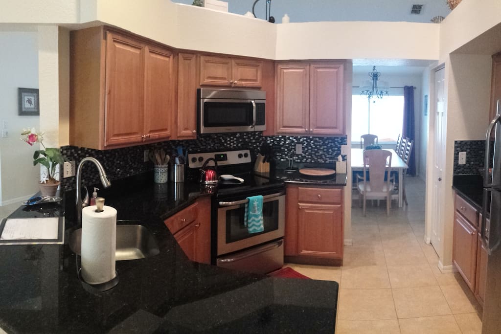 Beautifully renovated kitchen is fully stocked.