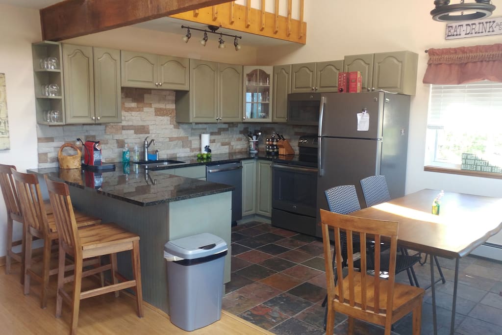 Spacious Kitchen with brand new appliances and granite counter top.