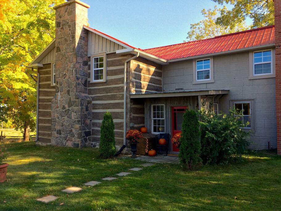 The main entrance is on the side of the house in the 1860s addition to the original log structure.