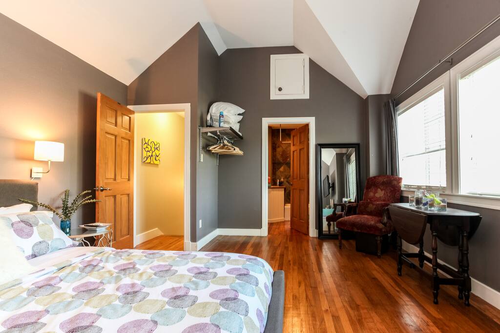 Full size mirror, nice sitting chair, iron, ironing board, and starch provided to help you look your best for a night on the town. The table in front of the window has a wing to fold out if you like to do your make-up in the natural light.