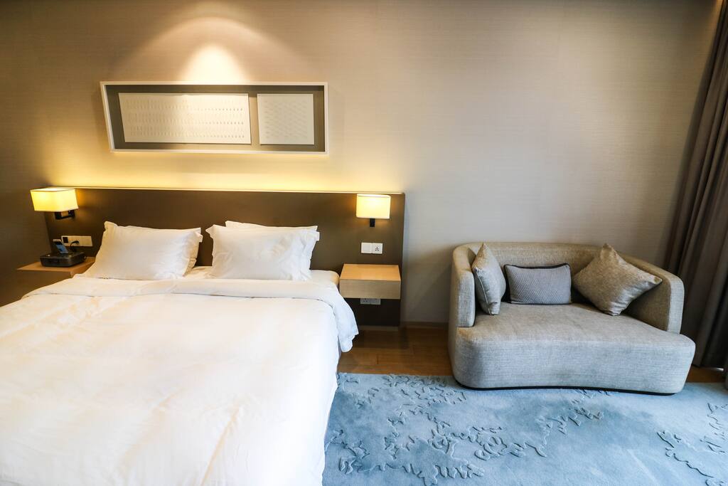 A couch by your bed for you to laze on