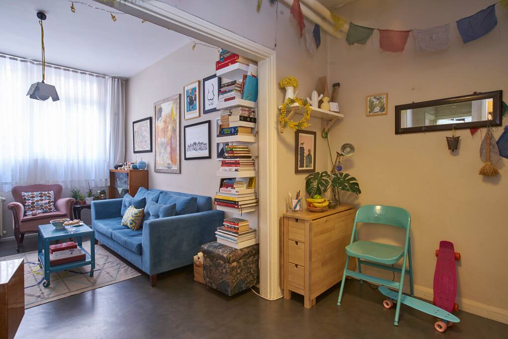 Living area and hall: The narrow desk in the middleof the photo by the wall is a table that can be used as 6 person table or a work station and table for 2.