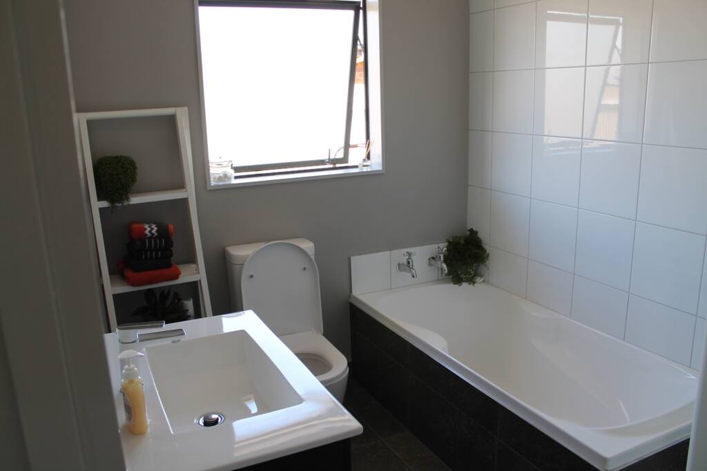 Bathroom with bath, toilet and shower