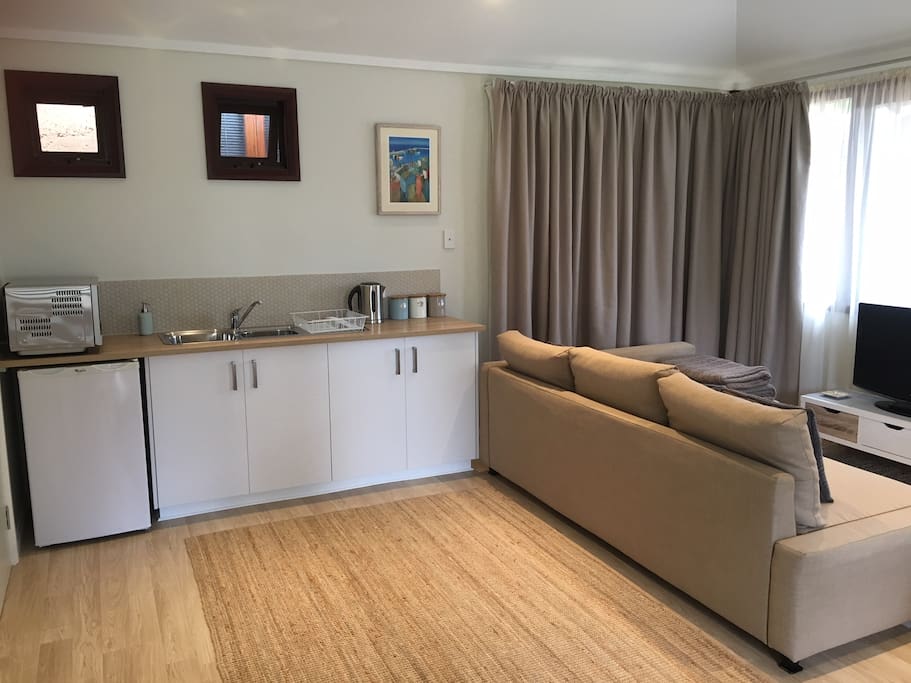 The lounge area also features a 32 inch LCD TV and custom made linen block out curtains.