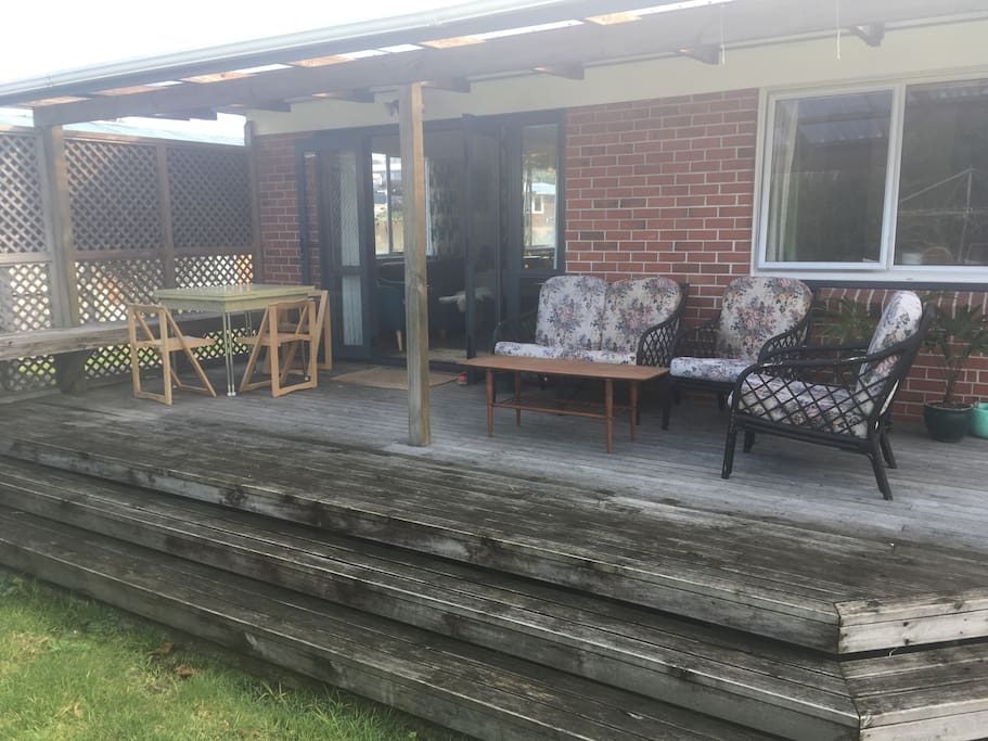 Private covered deck onto back lawn and vege garden