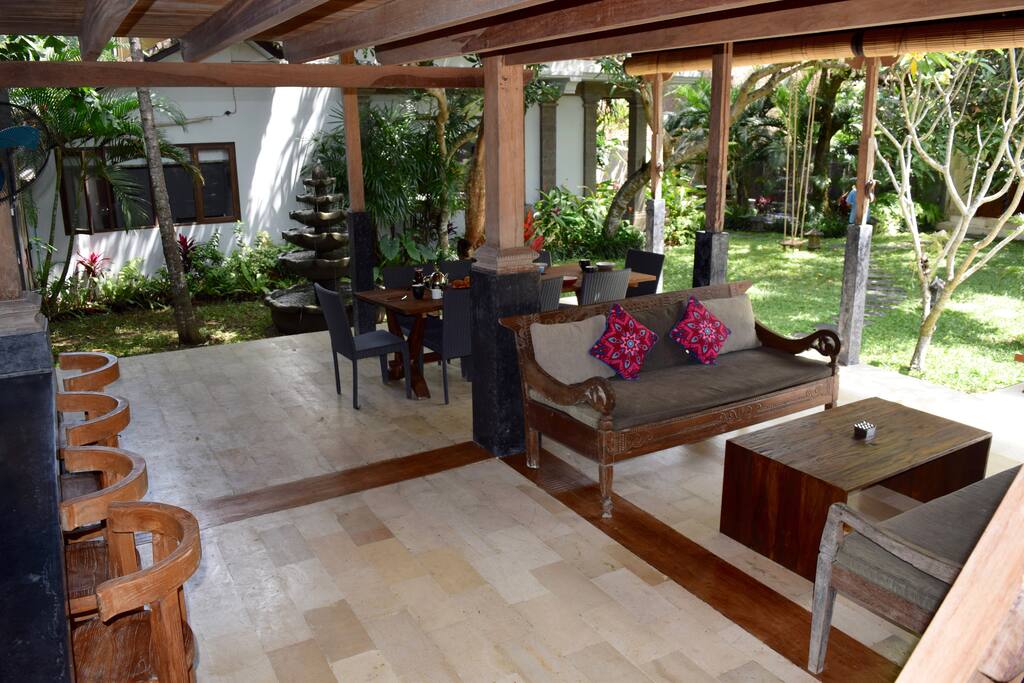 Outdoor living by the bar. The joglo has a third bathroom with open-air bath, shower and toilet.