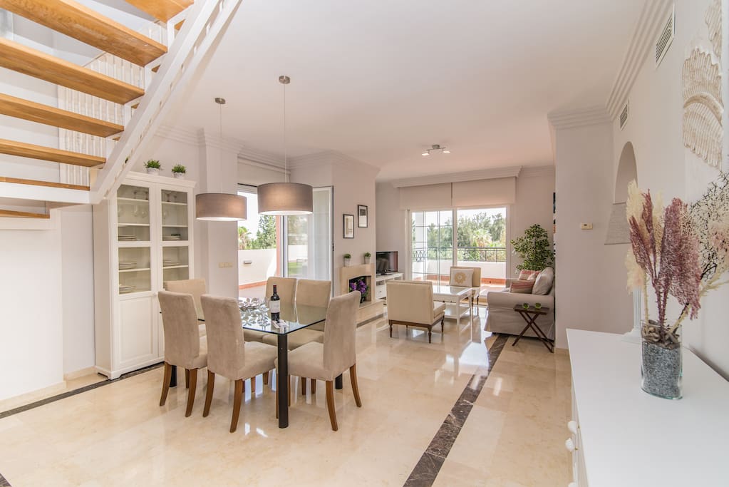 Lower floor - Spacious living room with comfy sofas, international TV and dining area