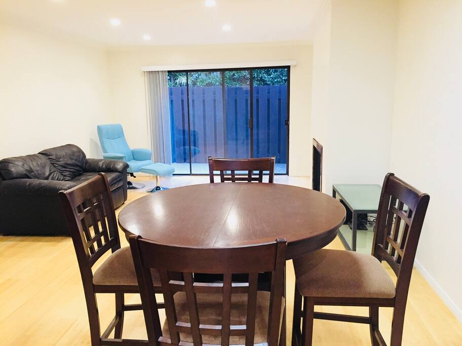 Large living/dining room space, opening up to patio.