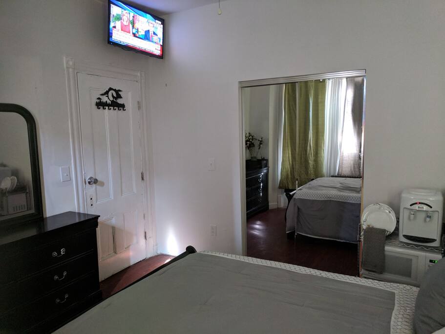 Plenty of mirrors to see your beautiful reflection. Behind the sliding glass doors awaits one newly renovated private bathroom.