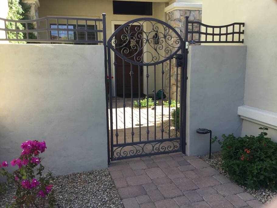 Iron gate entrance to your guest house
