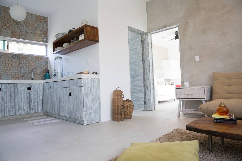 Modern and cozy kitchen-living room area.