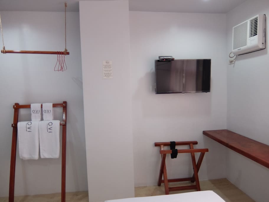 DIY closet, towel holder, luggage holder, 42" cable television & air-conditioned unit