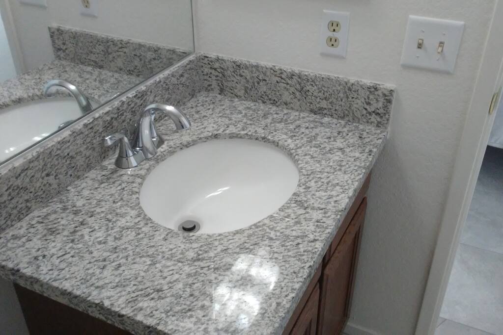 Both bathrooms, and the kitchen all have brand new real Granite countertops.