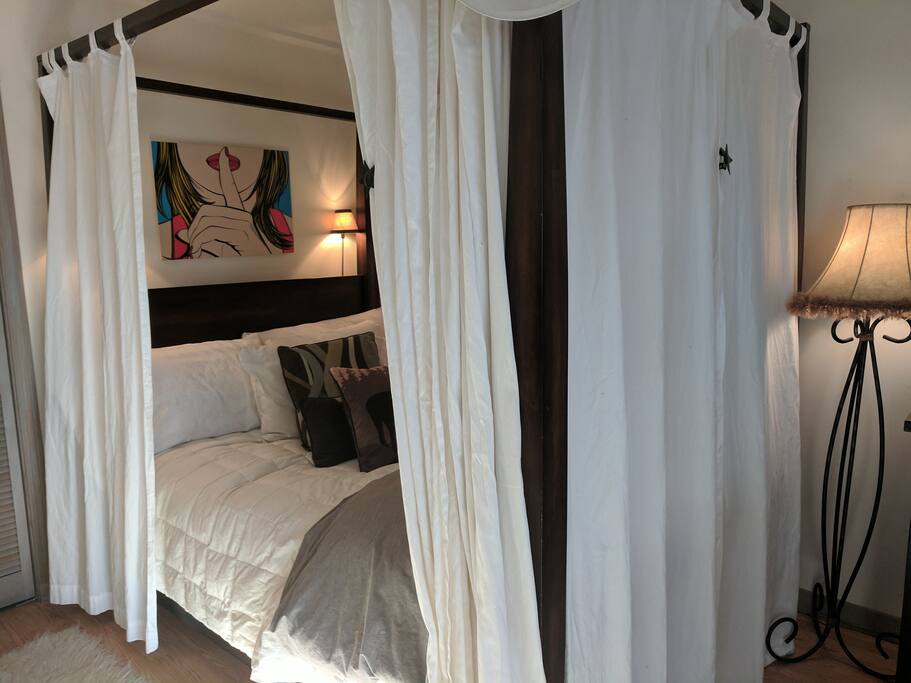 Cozy queen bed.