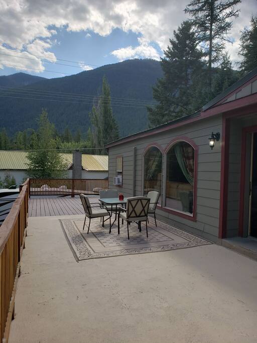 Wrap around deck with patio furniture