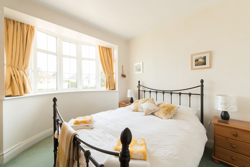 Main double bedroom with bay window looking out to the front of the property.
