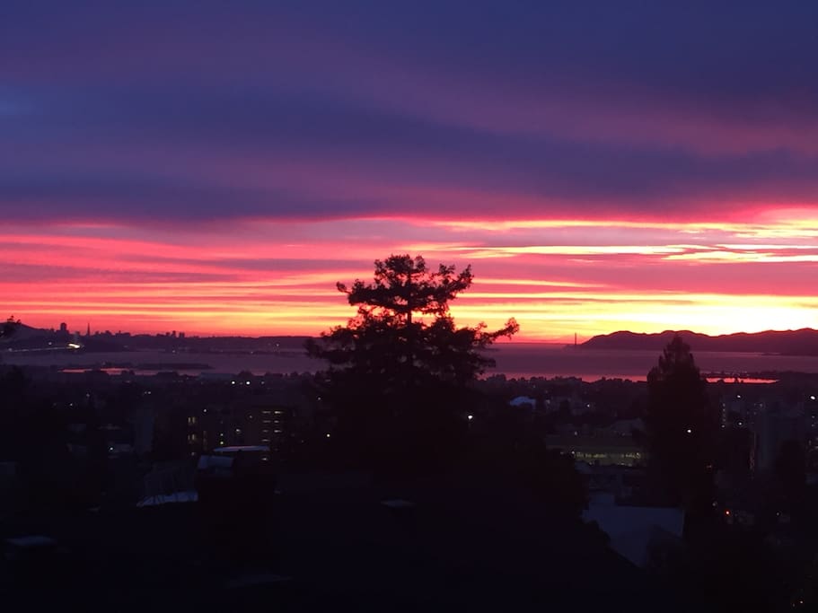 This is the view of a sunset from the living room, from the queen sized bed, from the dining table, from the roof, and from the kitchen.