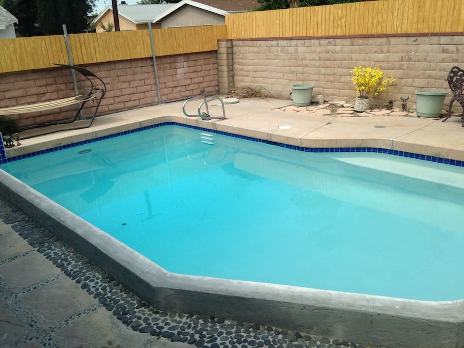 Relax by or in a very warm pool