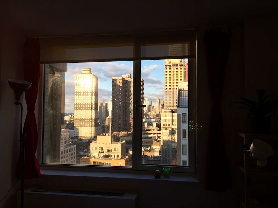 View of the late afternoon sun from your bedroom window. Apartment faces north, towards Hell's Kitchen.
