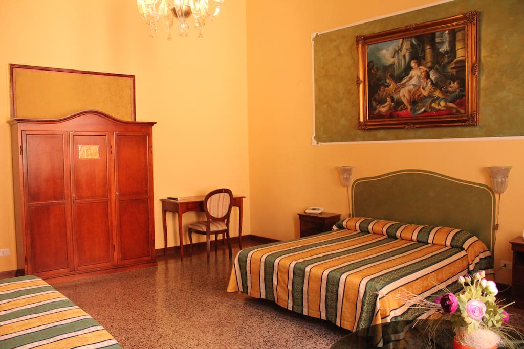 QUADRUPLE room OVERLOOKING small canal with private bathroom OUTSIDE the room (only one meter outside the room).