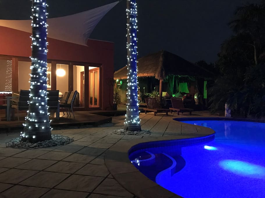 Pool and decking at night showing the lighting