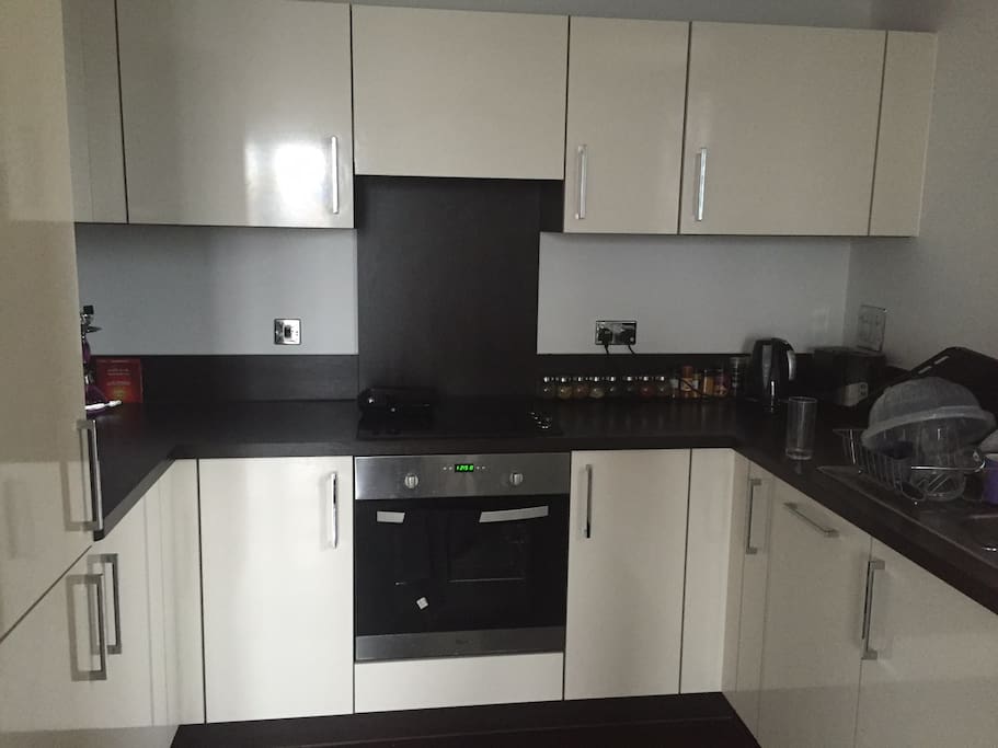 Full sized kitchen with oven, dishwasher, fridge, freezer and cooktop.