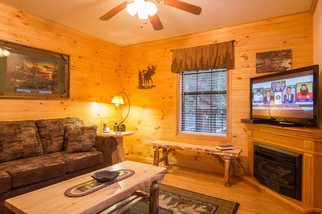 Living Room With A Sofabed, Aspen Log Tables, And A Gas Burning Fireplace (In Season).