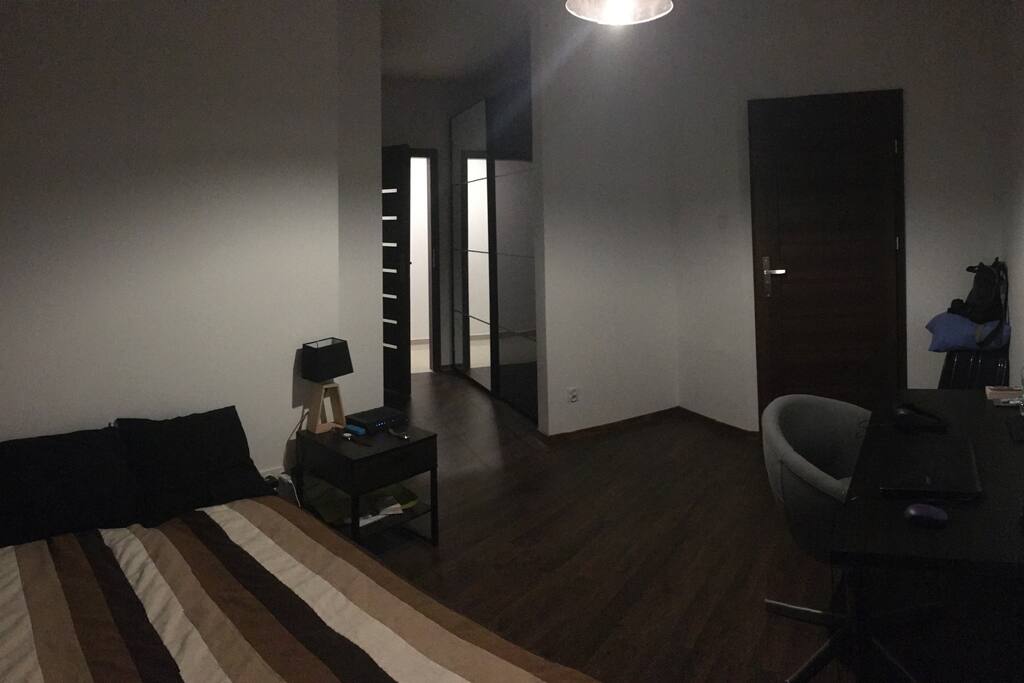 Spacious room with a double bed.
