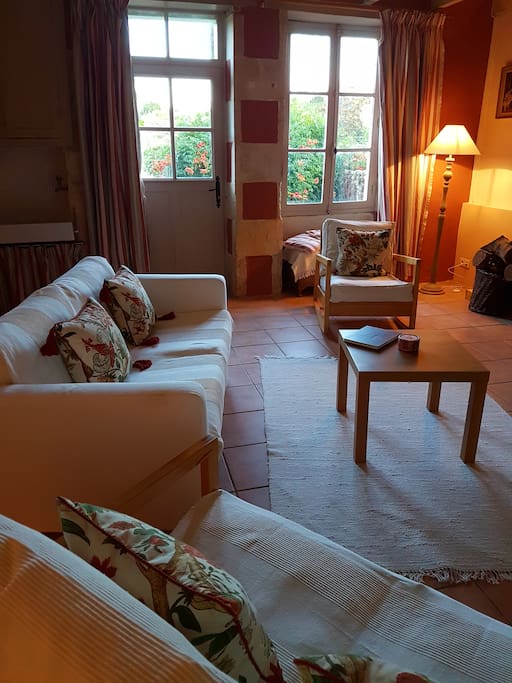 Gite cosy sitting room with log burning fire.