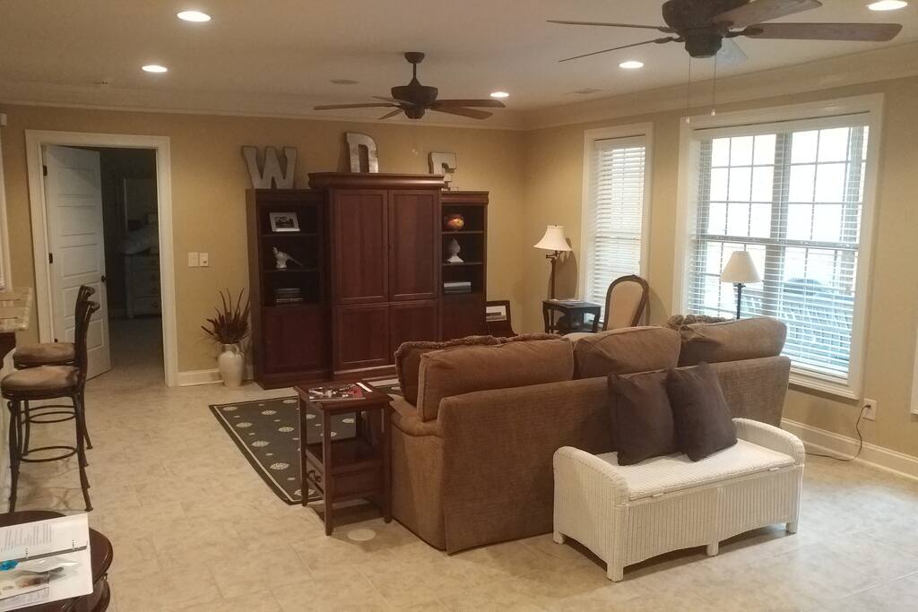 Den showing door on left to bedroom