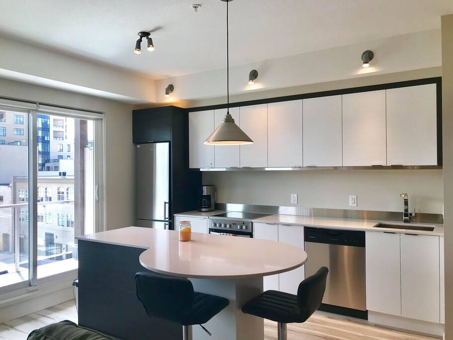 Fully stocked kitchen with eating bar