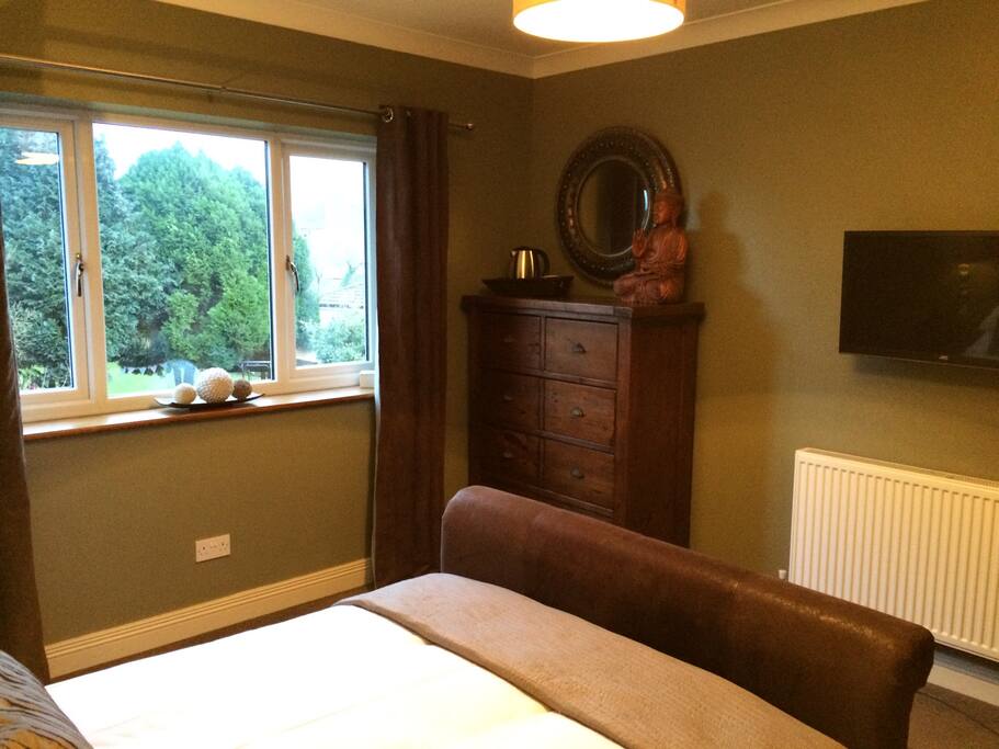 Have a lay in and watch TV after making yourself a drink from tea making facilities