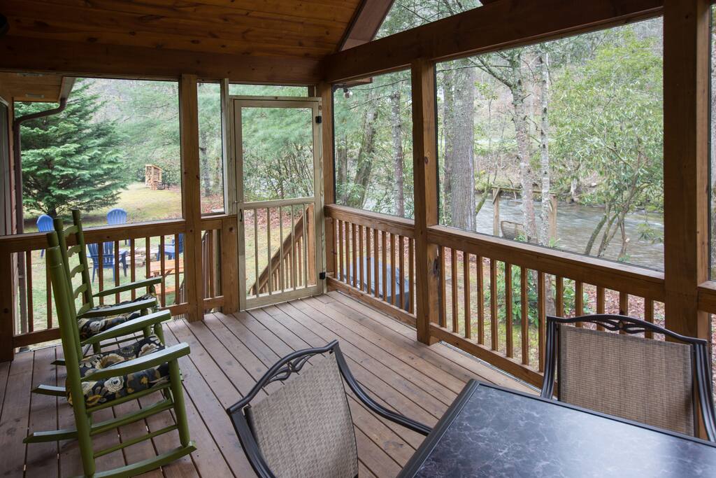 Relax and unwind by Snowbird Creek on the screened porch