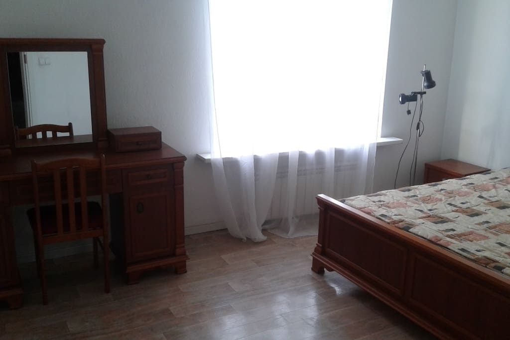 Bedroom No.2 with a built in wardrobe and racks for clothes. There is an iron and an ironing board available in the apartment. Washing machine is located in the kitchen.