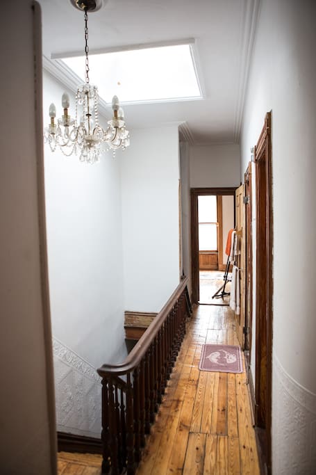 Main Hall with walk in closet and skylight.