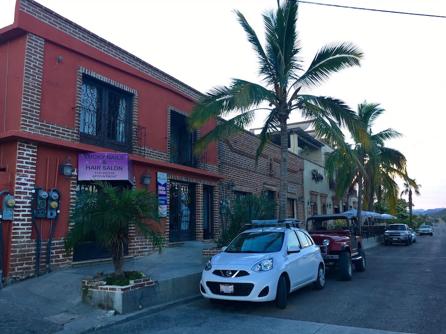 Apt is upstairs in red bldg, Hotel Casa Tota in distance