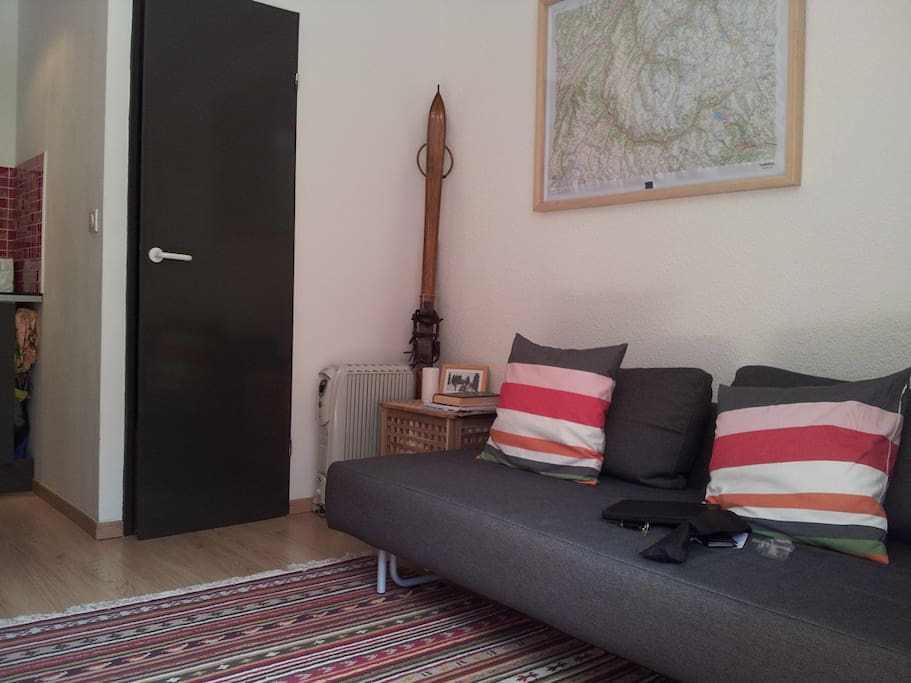 Open plan living room with double sofa bed