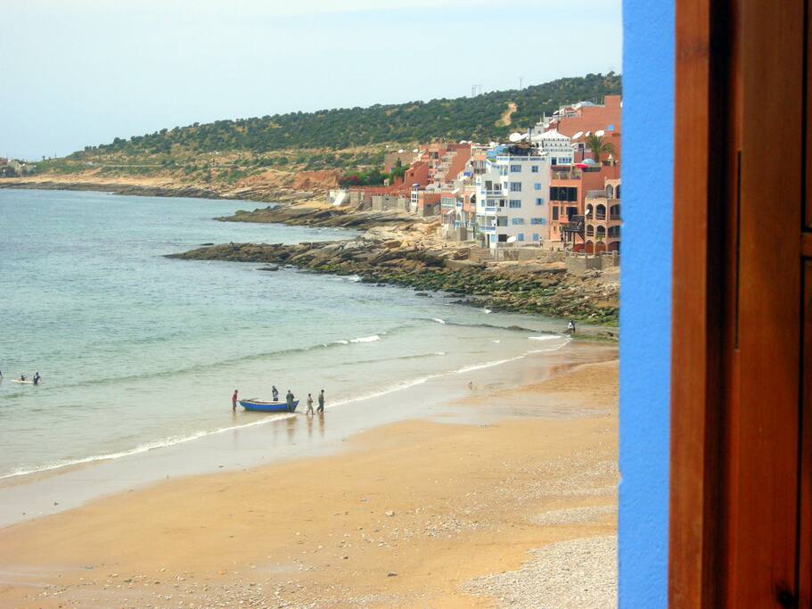 Watching the fisher men bringing in the fresh fish in town's bay.