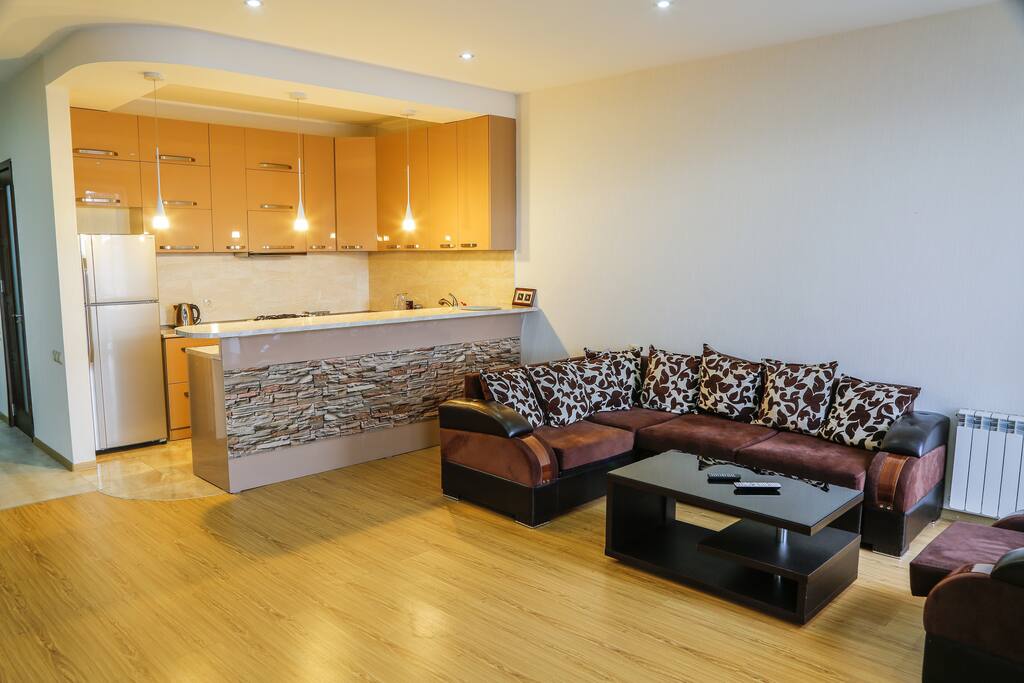 Living room, sitting area, coffee/tea facilities, dining area.